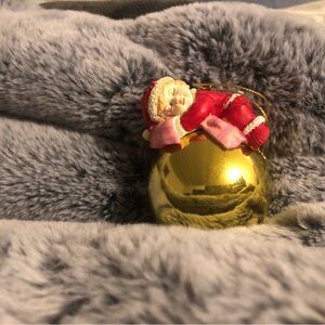 Gold Ornament with Sleeping Santa Figurine